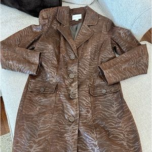 Woman’s long small brown trench coat